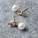 Perlulokkar m. hnút